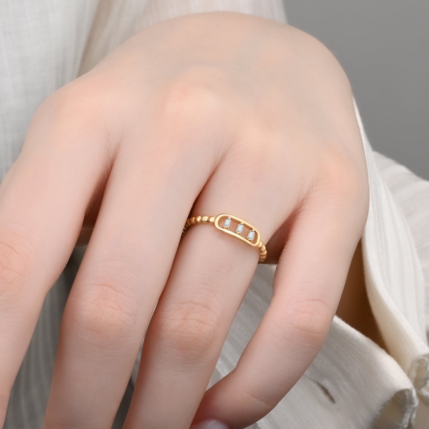 14K Yellow Gold Beaded Band Ring with Three Baguette Zirconia