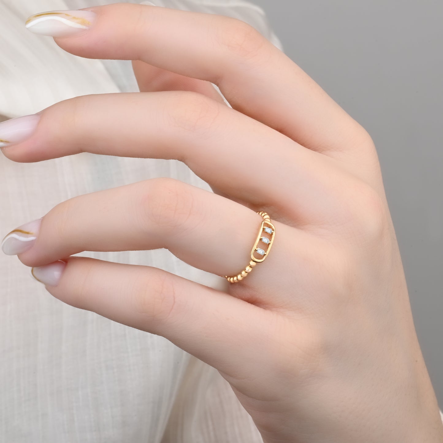 14K Yellow Gold Beaded Band Ring with Three Baguette Zirconia